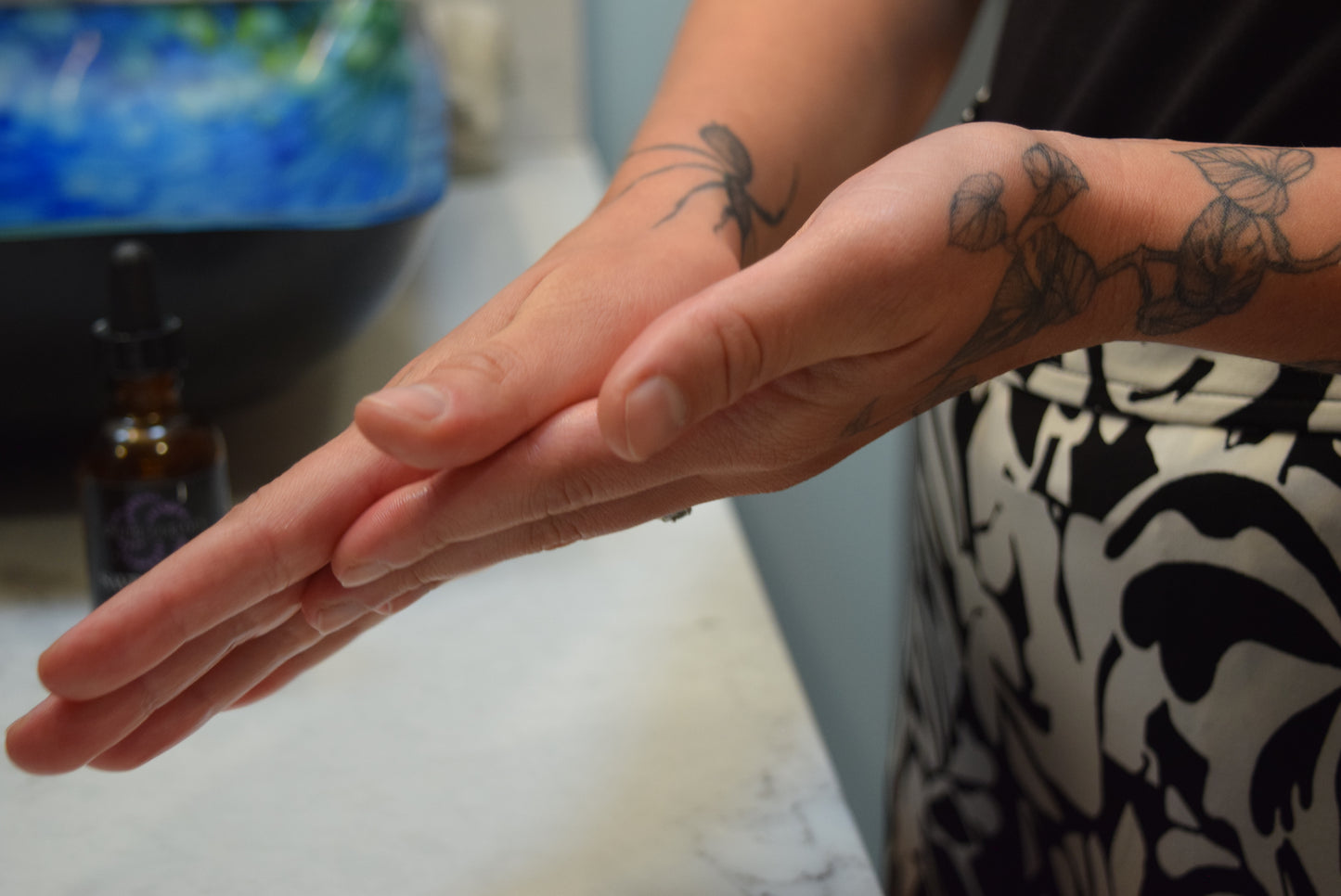 Warming Saving Face Serum between hands