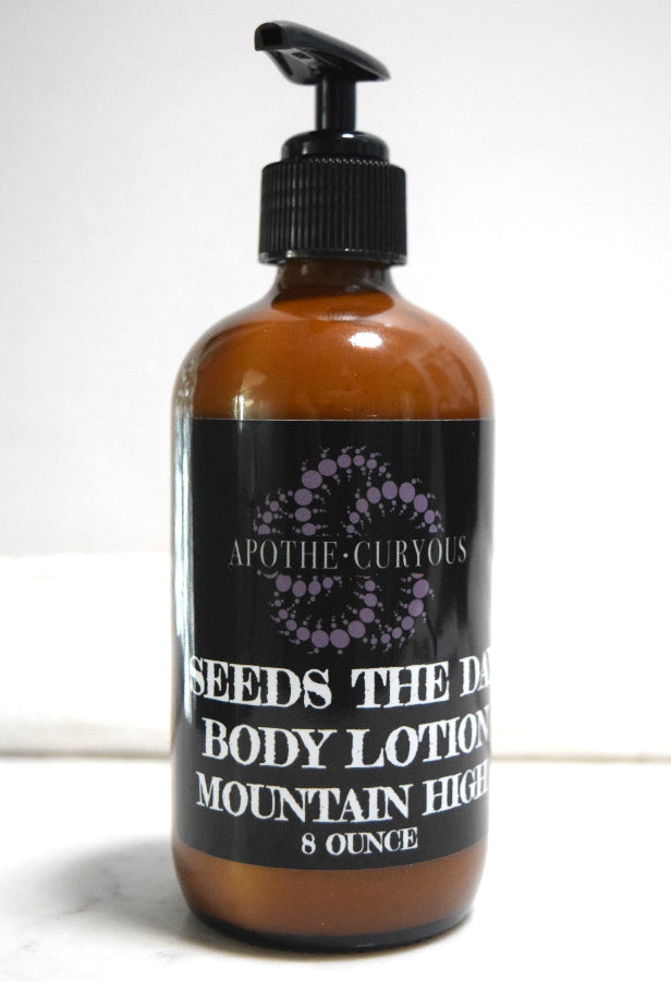 8 ounce amber glass bottle of Seeds the Day body lotion in Mountain High scent. Apothecuryous