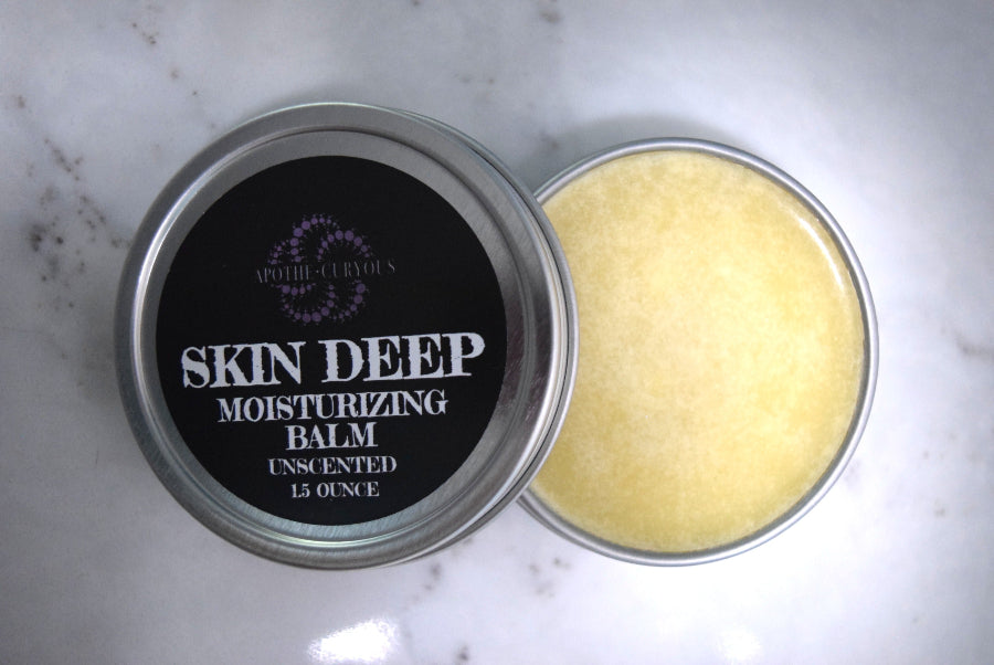 Skin Deep moisturizing balm in a metal tin, lid off, Apothecuryous