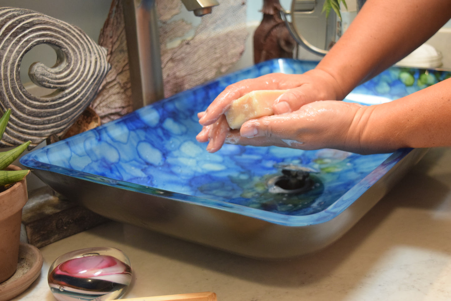 Washing hands with bar soap at bathroom sink, Apothecuryous