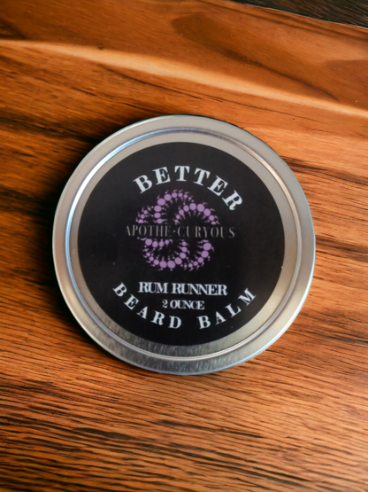 Better Beard Balm in aluminum tin on wood surface, Apothecuryous