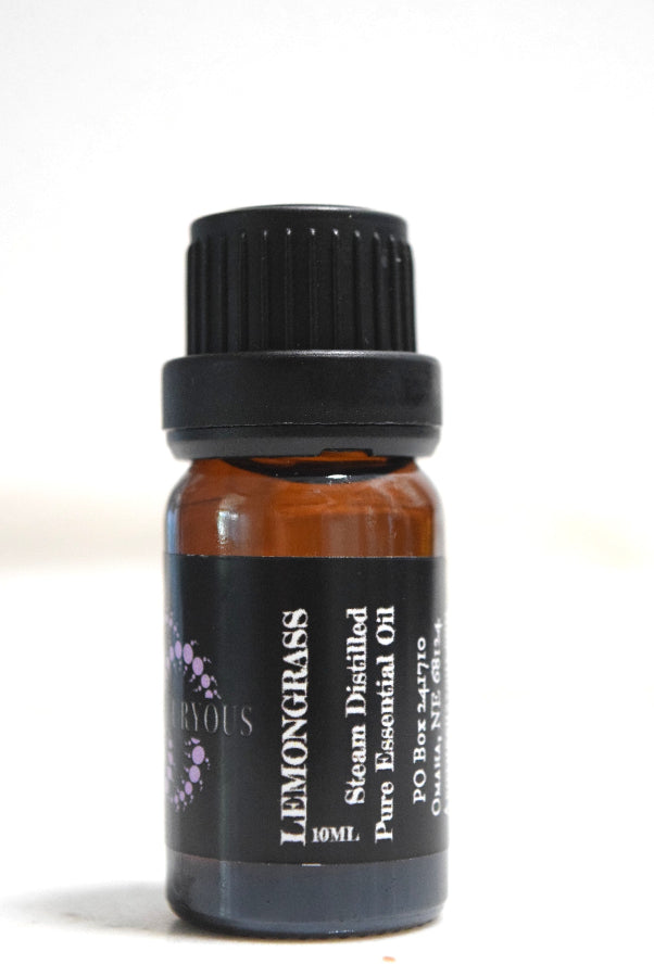A 10ml amber glass bottle of Lemongrass essential oil with a black ribbed cap and a black label featuring white text and a small purple graphic.