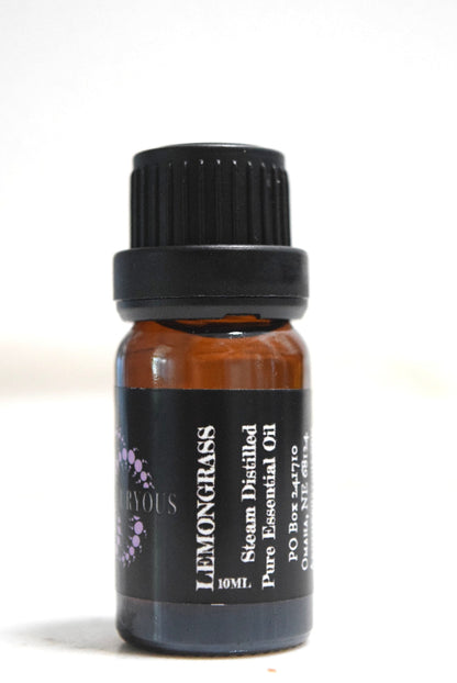A 10ml amber glass bottle of Lemongrass essential oil with a black ribbed cap and a black label featuring white text and a small purple graphic.