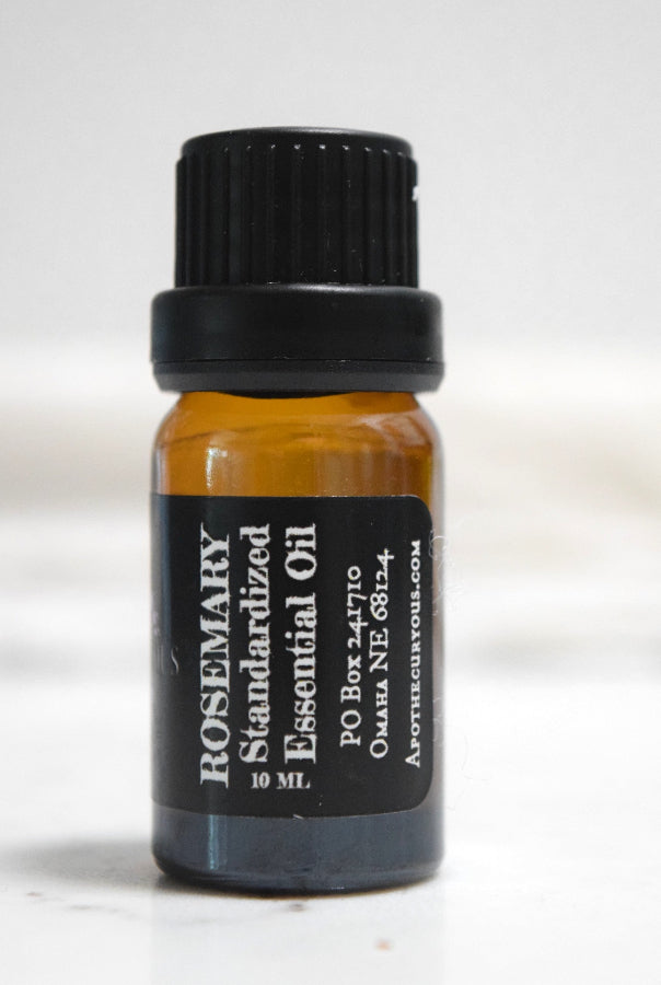 A 10 mL amber glass bottle of Rosemary Standardized Essential Oil with a black ribbed cap and a black label featuring white text, set against a plain white background.
