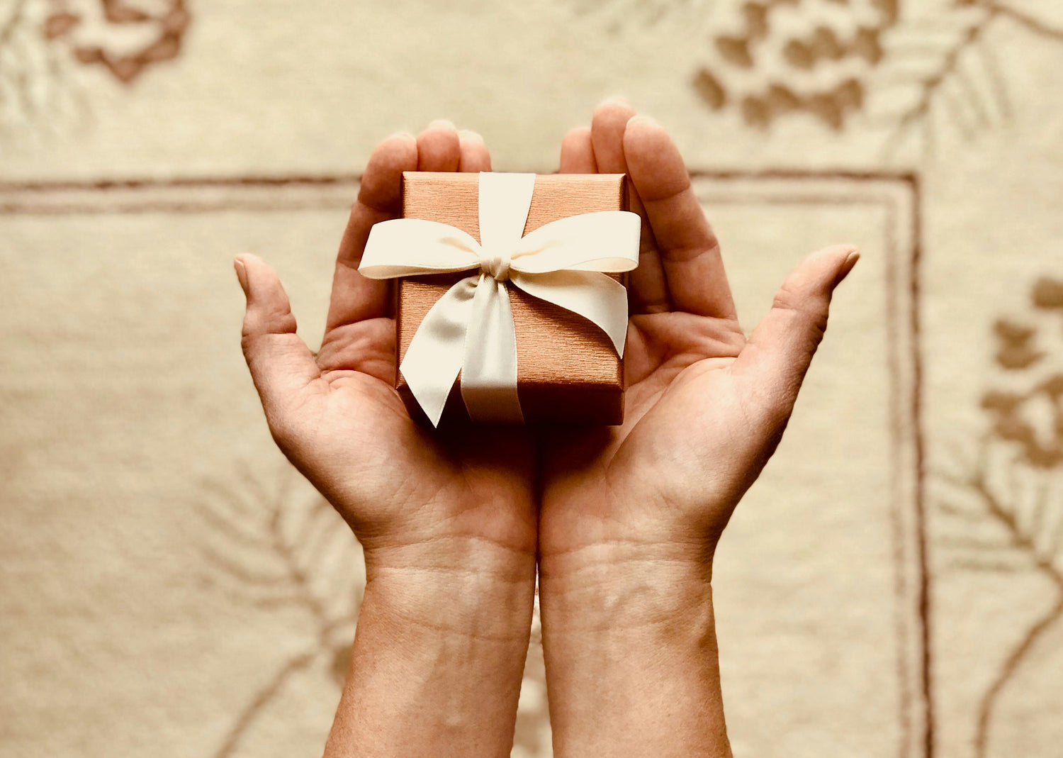 Photo by Kim Stiver: https://www.pexels.com/photo/person-s-holds-brown-gift-box-842876/