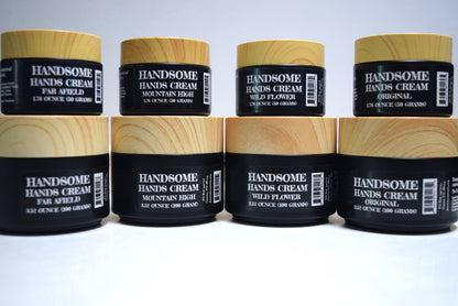 Multiple jars of Handsome Hands Cream stacked on a white background