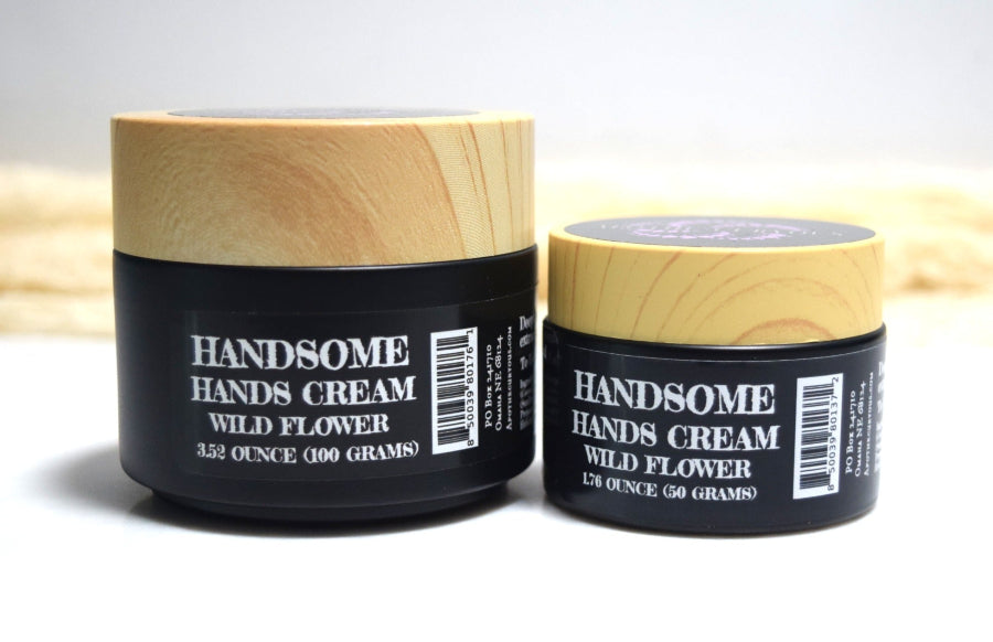 Two jars of 'Handsome Hands Cream Wild Flower' on a light background