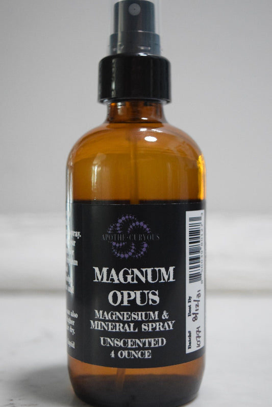 An amber glass spray bottle of Magnum Opus Magnesium & Mineral Spray, unscented, Apothecuryous