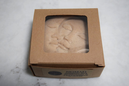 Sun and Moon molded shampoo bar in brown paper craft box with window.