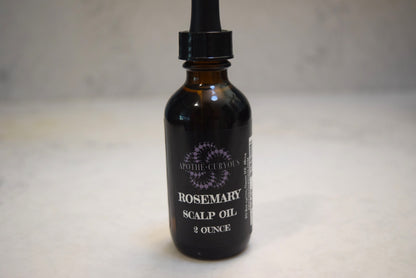 Rosemary scalp oil in amber glass bottle with dropper top, Apothecuryous