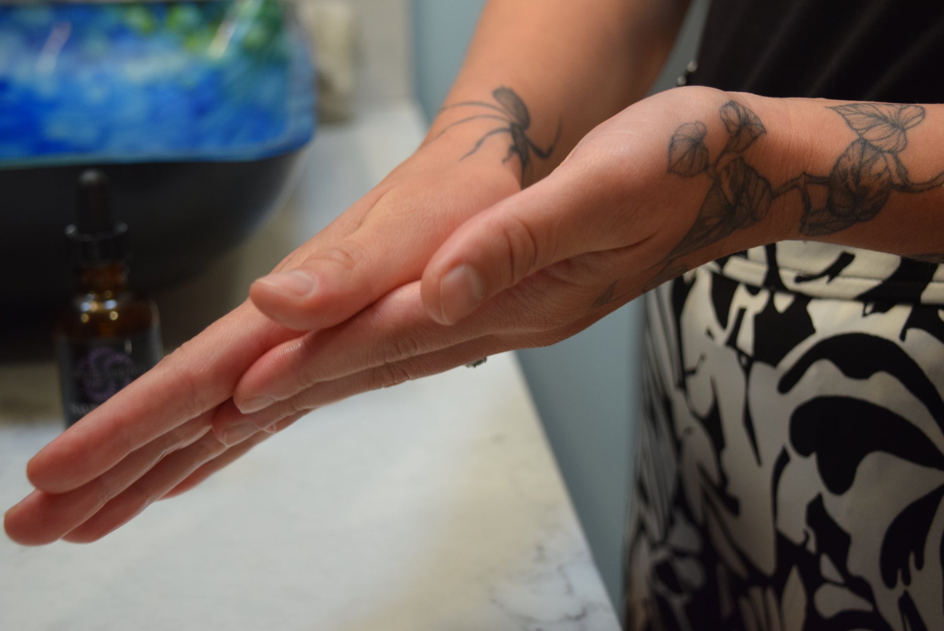 Warming Saving Face Serum between hands