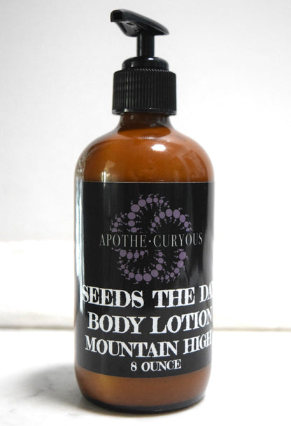 8 ounce amber glass bottle of Seeds the Day body lotion in Mountain High scent. Apothecuryous