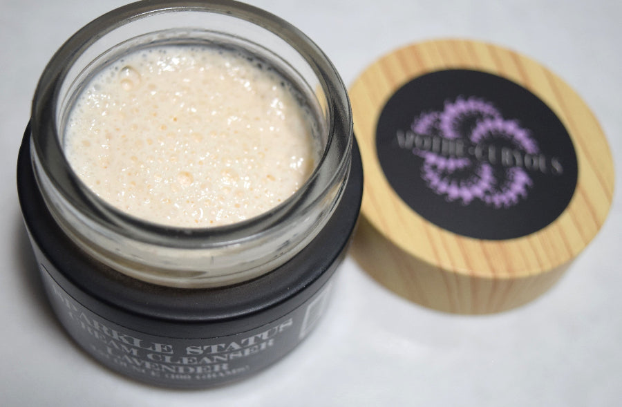 Sparkle Status cream cleanser with the lid off, showing rich creamy texture. Apothecuryous