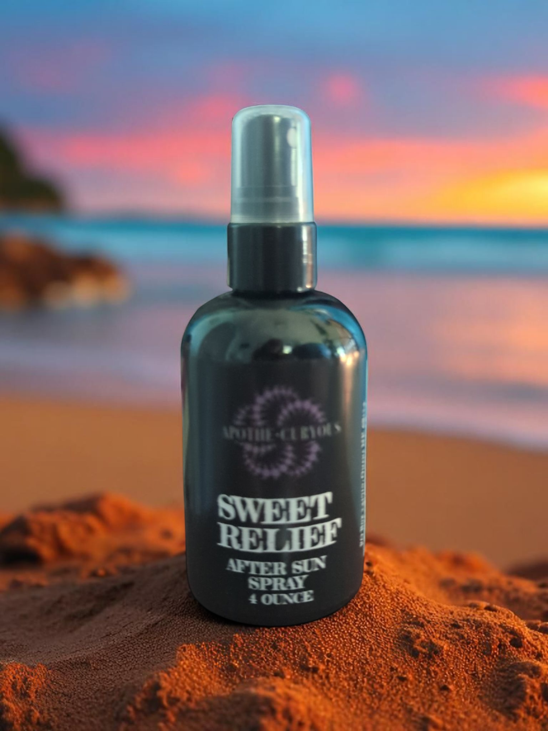 Bottle of Sweet Relief after sun spray on a beach at sunset