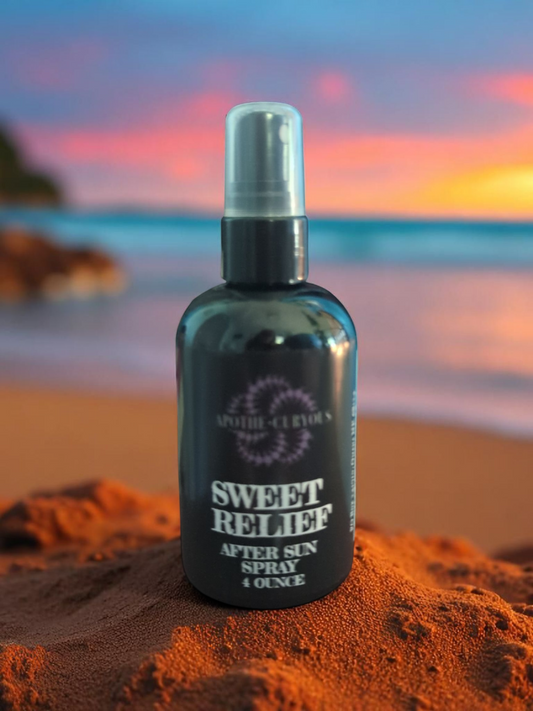 Bottle of Sweet Relief after sun spray on a beach at sunset
