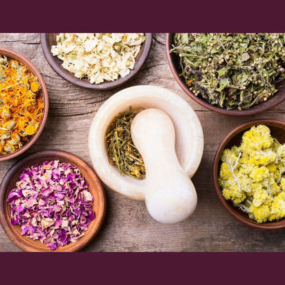 Herbs in bowls with mortar and pestle