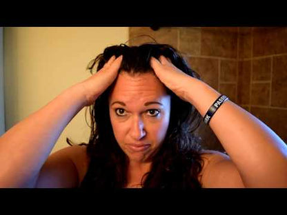 Still of YouTube video demonstrating how to apply Rosemary Scalp oil, Apothecuryous